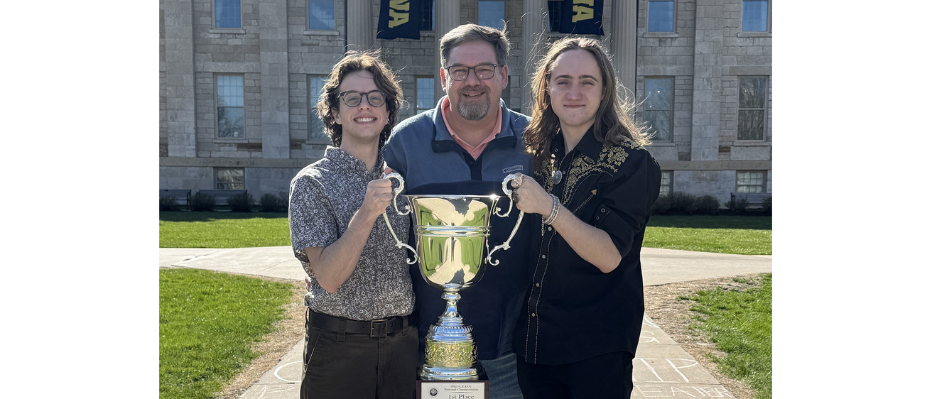 Spencer (L) Paul Bellus (C) Grey (R) hoisting National Championship Trophy
